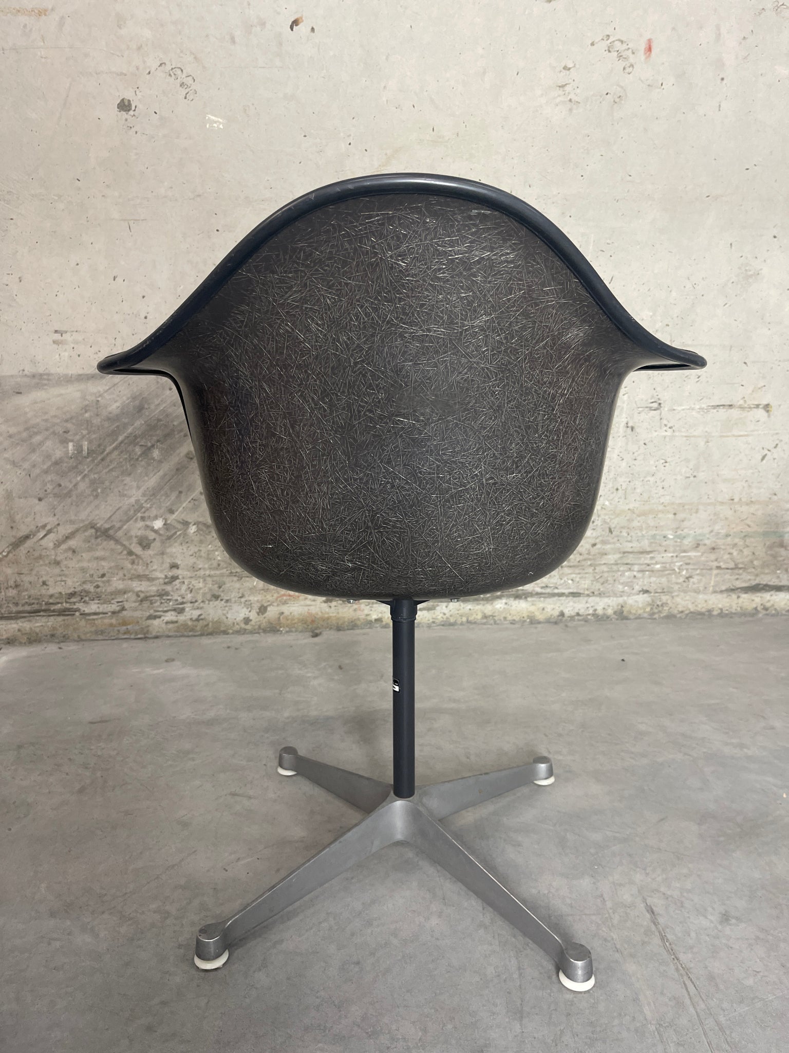 Eames fiberglass shell armchair